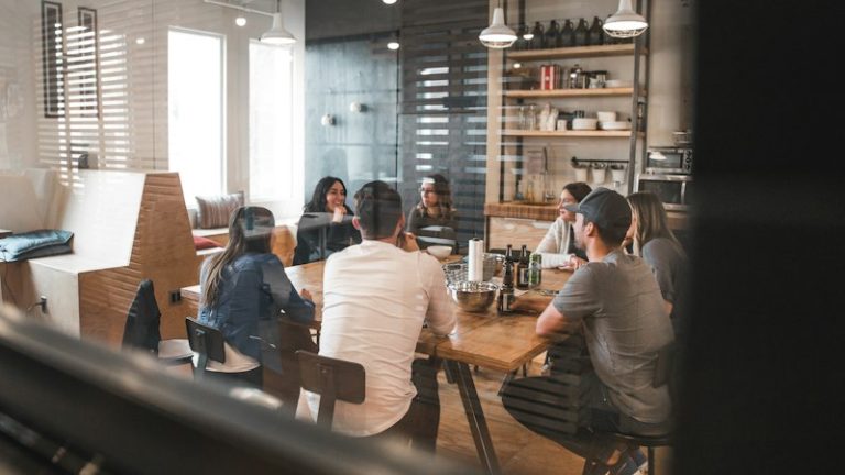 Team meeting shown in an illustrative professional services website design